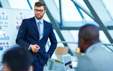 Young businessman making presentation to his colleagues